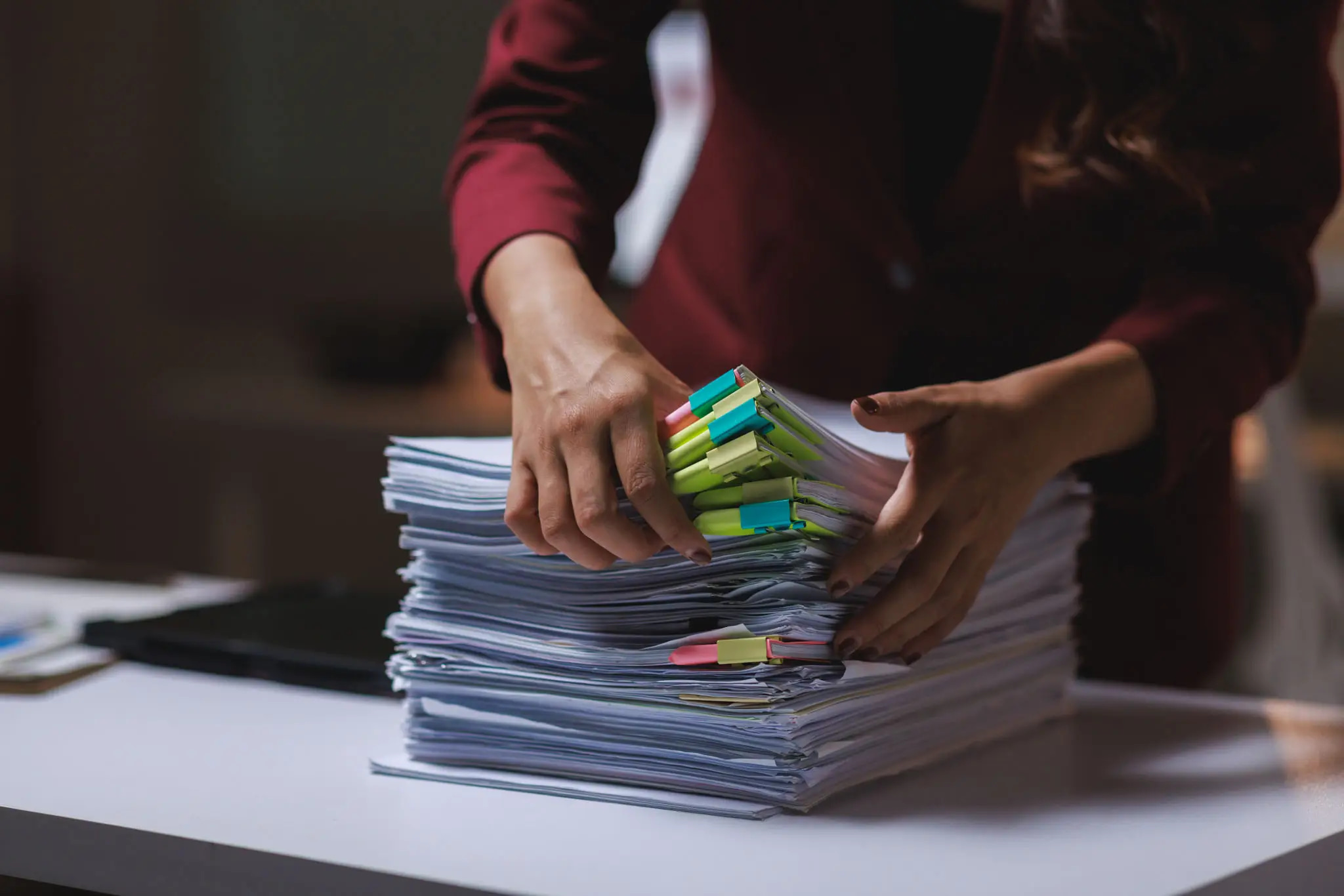 Audit professional organizing an examiner review evidence package