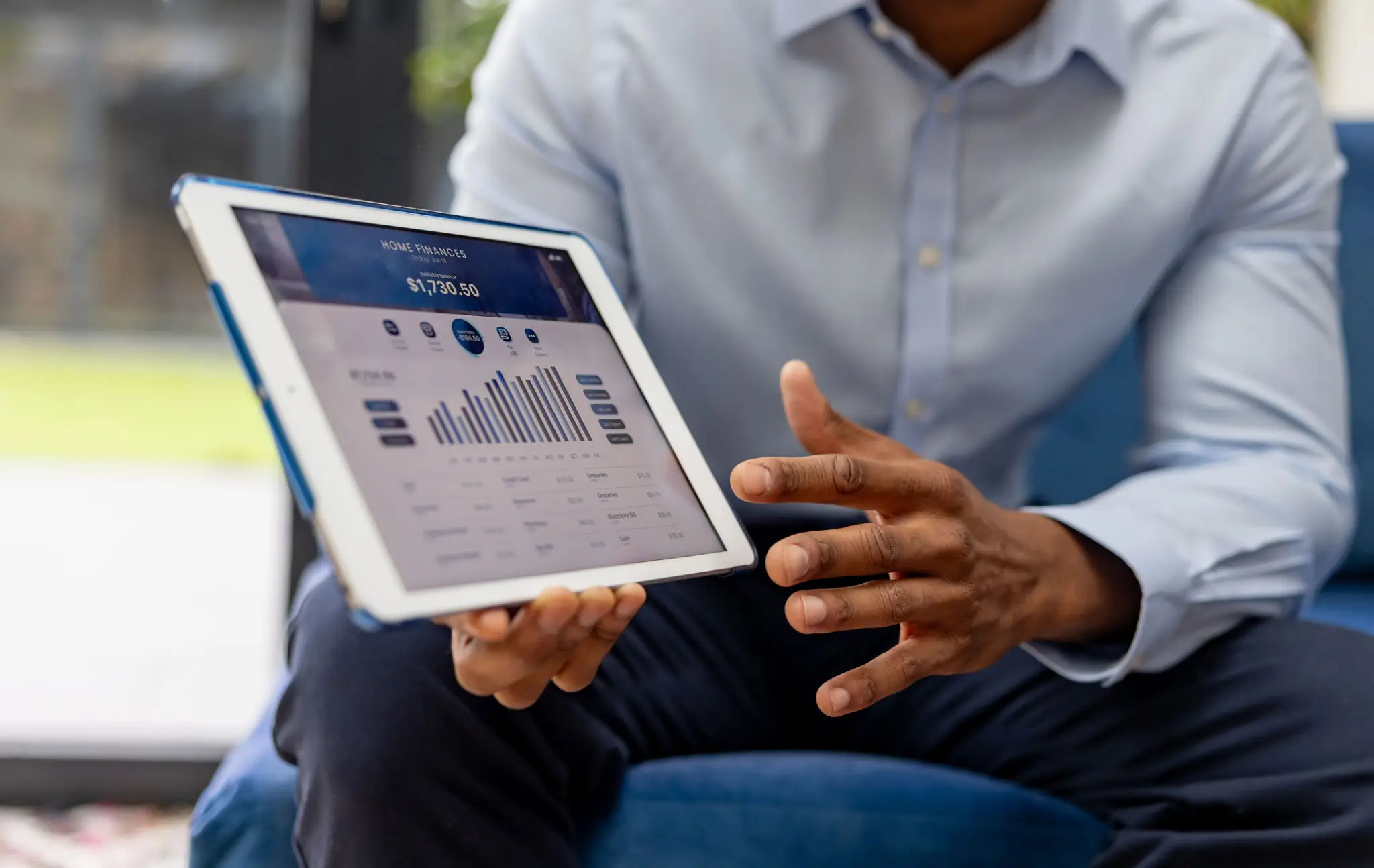 Bank executives reviewing a portfolio performance dashboard