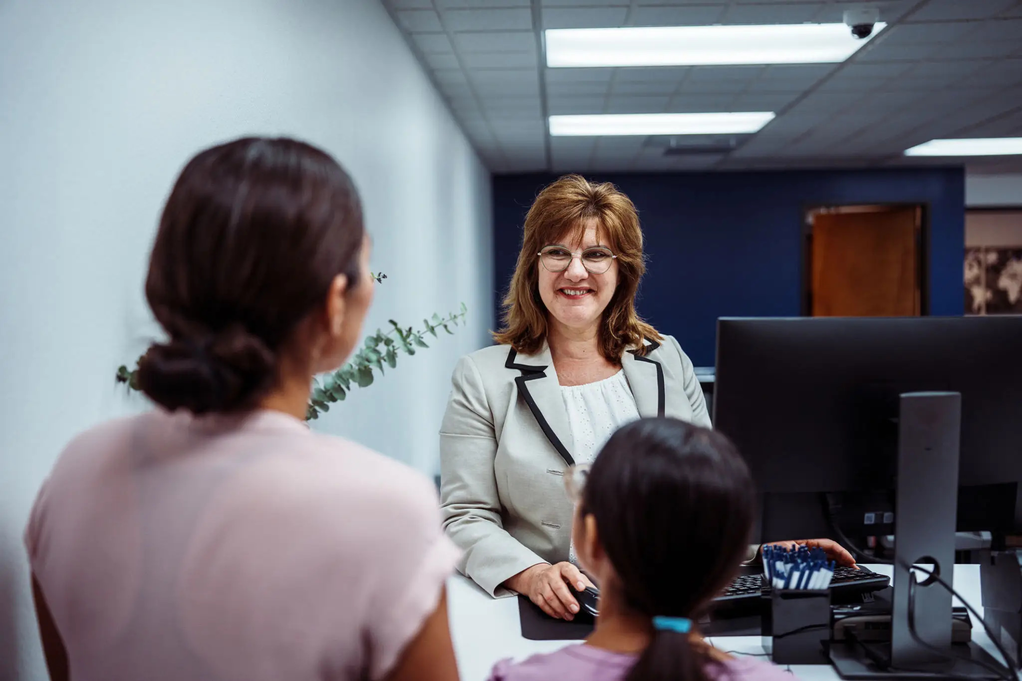 Banker helping customers act on relevant relationship and deposit needs